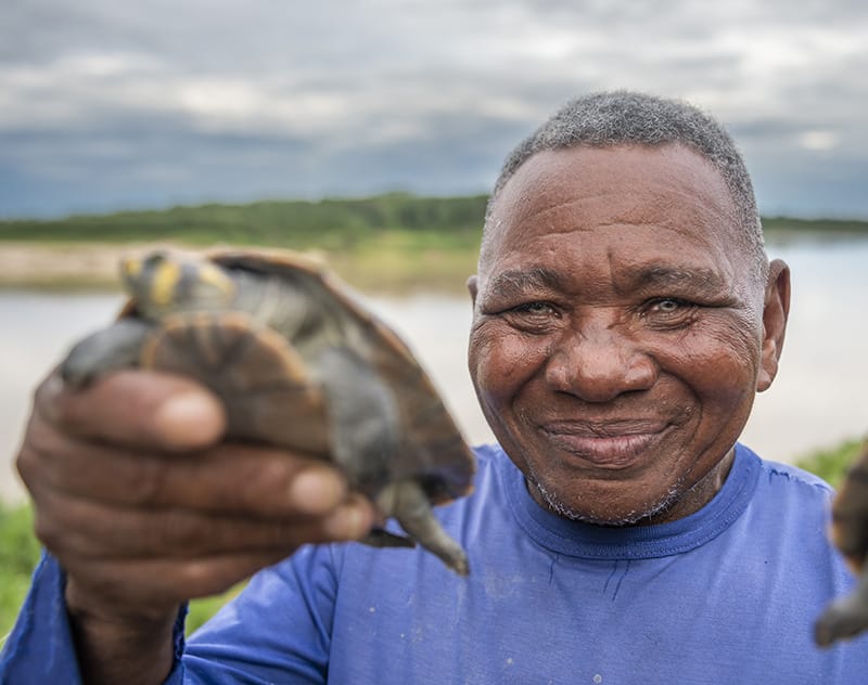 Man showing a turtle