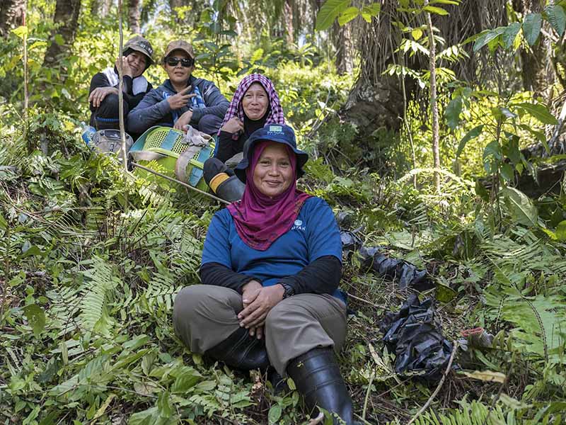 a group of people posing in nature