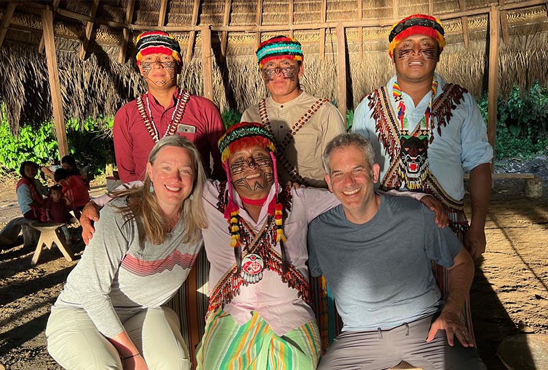 Jessica and Adam with people from the Amazon Sacred Headwaters Alliance