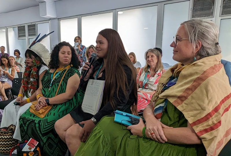 Danielle Ray Frank speaking at a COP16 side event next to Jessica Sweidan