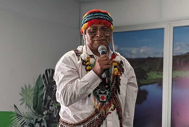 Uyunkar Domingo Peas Nampichkai speaking into a microphone